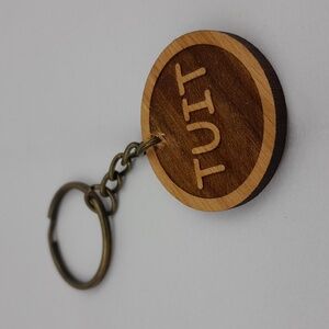 A Round Wooden Tuit Keychain